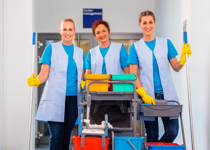 Cleaning service at work, tree women in teamwork